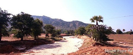 Mount Popa in the distance.