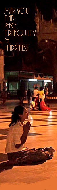 Burmese woman saying prayers