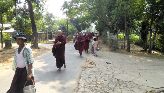 Burmese Buddhist Monks going for alms